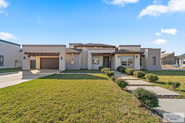 view of front facade featuring a garage and a front lawn