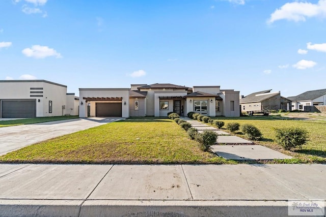 view of front facade featuring a garage and a front yard