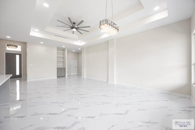 5359 Sidekick Ave, Brownsville, TX 78526 - unfurnished living room with a tray ceiling, a ceiling fan, recessed lighting, and marble finish floors