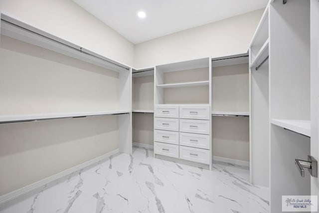 5359 Sidekick Ave, Brownsville, TX 78526 - walk in closet featuring light marble finish flooring