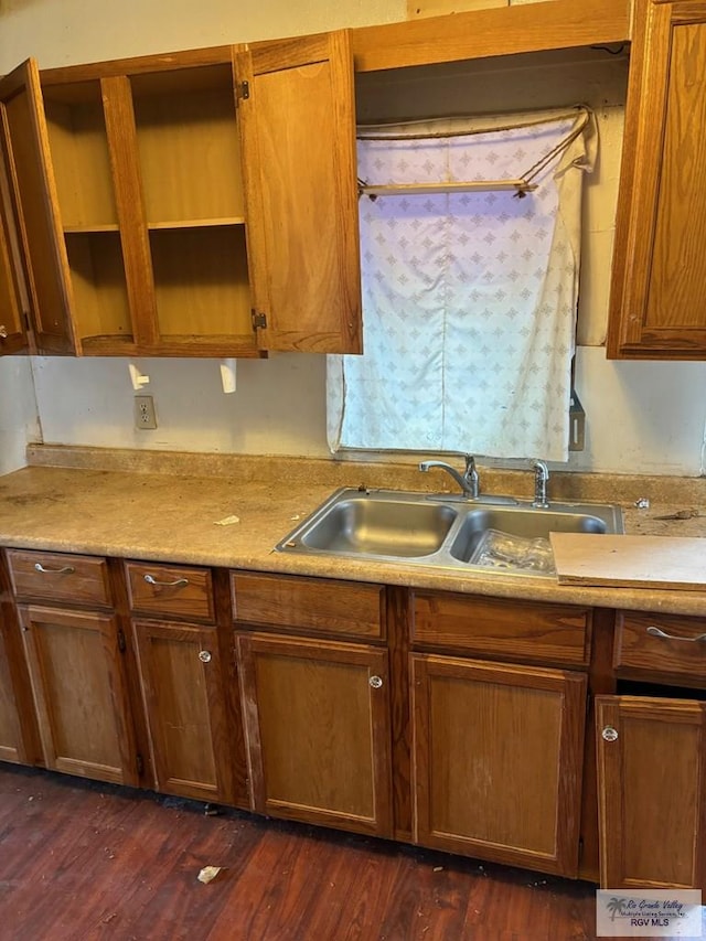 821 Virginia Ave, La Feria, TX 78559 - kitchen featuring dark wood-style flooring, open shelves, light countertops, and brown cabinets