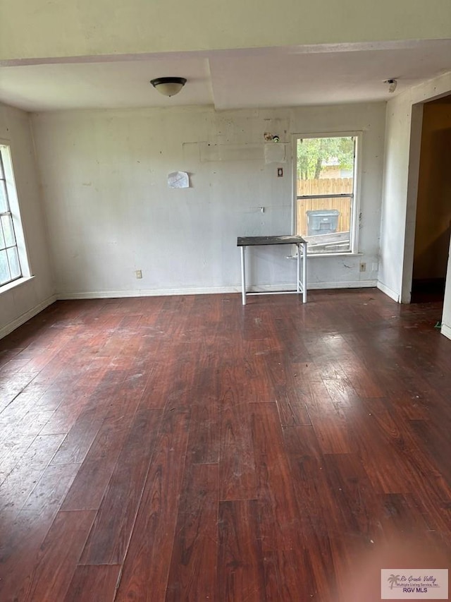 821 Virginia Ave, La Feria, TX 78559 - unfurnished living room with hardwood / wood-style flooring