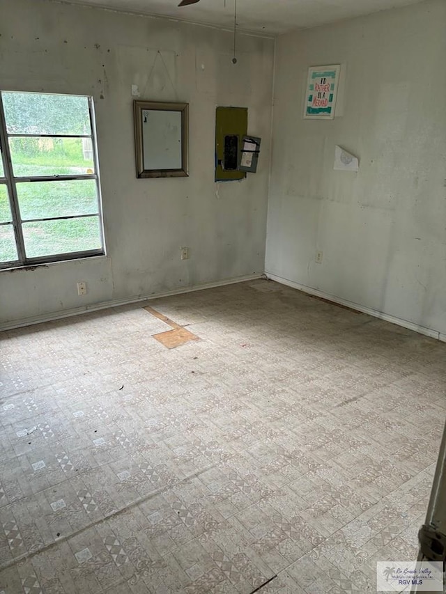 821 Virginia Ave, La Feria, TX 78559 - empty room with electric panel and ceiling fan