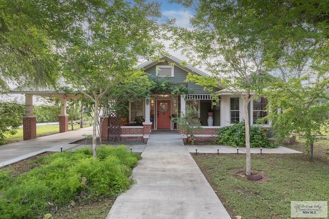 701 S Parker Rd, La Feria, TX 78559 - bungalow featuring driveway, covered porch, and a carport