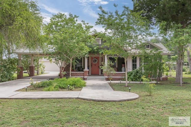 701 S Parker Rd, La Feria, TX 78559 - view of front of property with a porch and a front yard