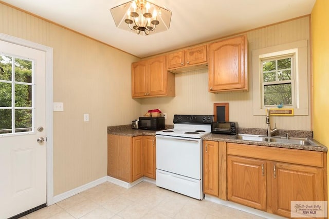 701 S Parker Rd, La Feria, TX 78559 - kitchen featuring black microwave, a sink, plenty of natural light, and white range with electric stovetop