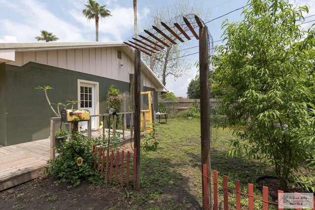 701 S Parker Rd, La Feria, TX 78559 - exterior space featuring fence and a wooden deck
