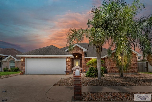 ranch-style home featuring a garage