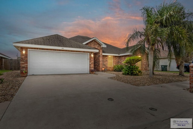 ranch-style house featuring a garage