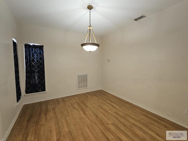 2884 Gibraltar St, Brownsville, TX 78520 - unfurnished room with wood finished floors and baseboards