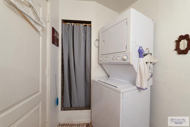 washroom with stacked washer and dryer