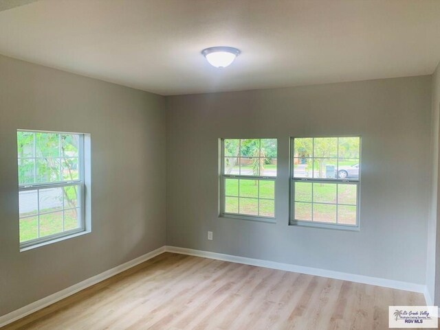 unfurnished room featuring light hardwood / wood-style flooring