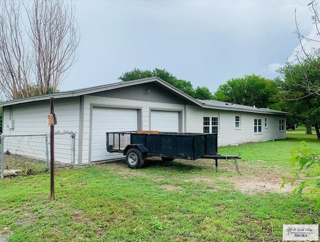 garage with a yard