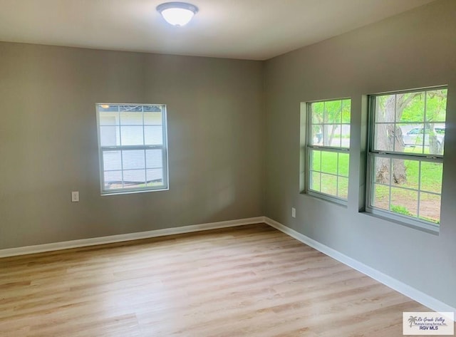 1218 S 16th St, Harlingen, TX 78550 - unfurnished room featuring light wood finished floors and healthy amount of natural light