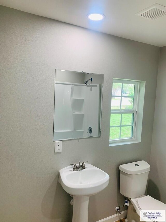 bathroom with toilet and sink