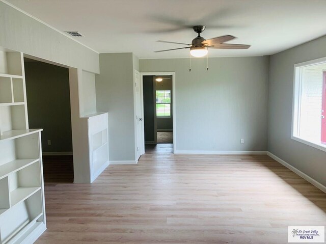 unfurnished room with ceiling fan and light hardwood / wood-style flooring