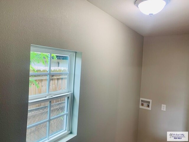 1218 S 16th St, Harlingen, TX 78550 - washroom with hookup for a washing machine and plenty of natural light