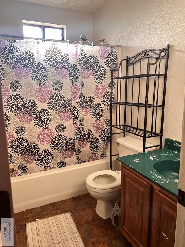 full bathroom featuring vanity, toilet, a textured ceiling, and bathing tub / shower combination