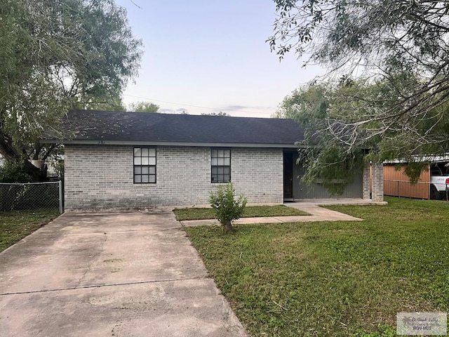 view of front of home with a lawn