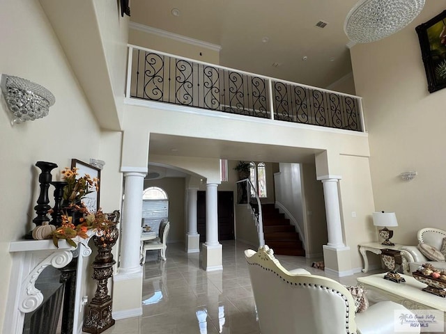 interior space featuring a high ceiling and crown molding