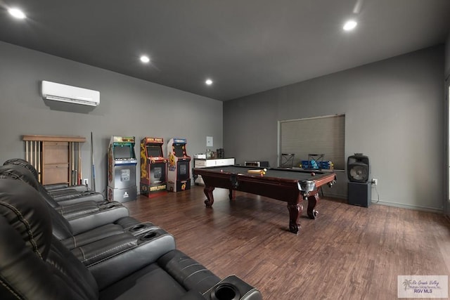 game room featuring a wall mounted air conditioner, hardwood / wood-style flooring, and pool table