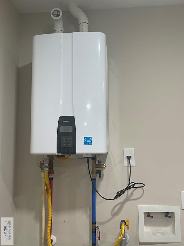 utility room with water heater