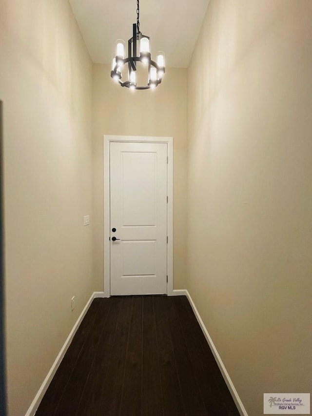 entryway featuring a chandelier and hardwood / wood-style floors