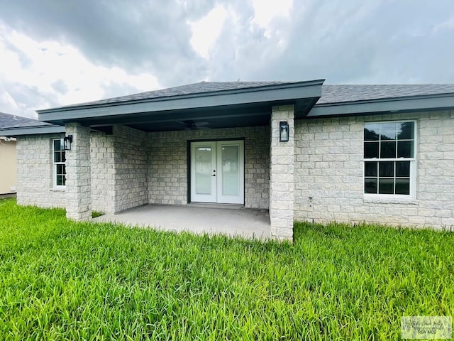 back of house with ceiling fan, a patio, and french doors