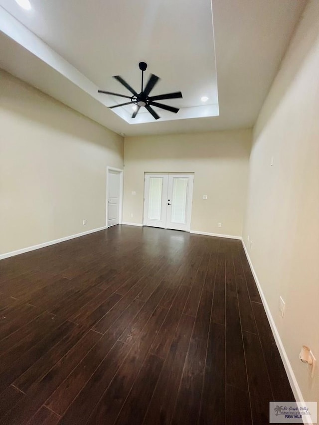 unfurnished room featuring ceiling fan and dark wood-type flooring