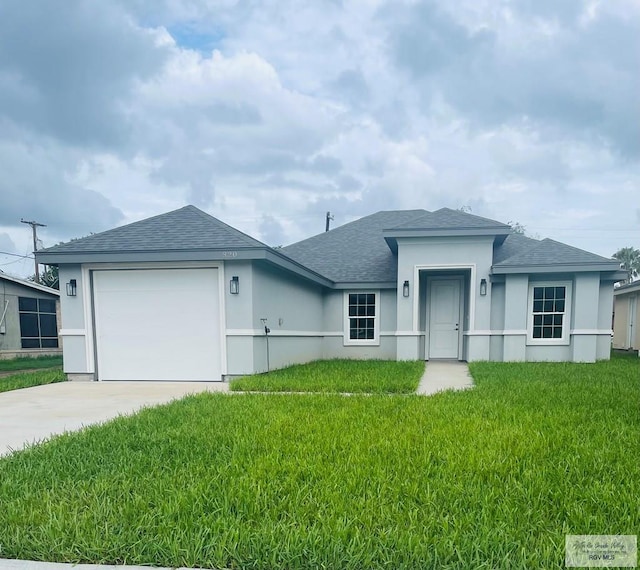 single story home featuring a front yard and a garage