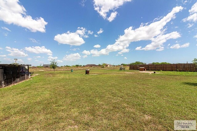 view of yard with a rural view