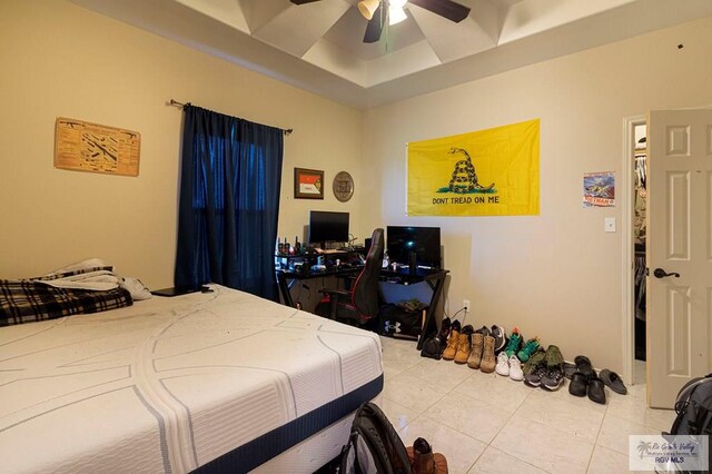 tiled bedroom with ceiling fan