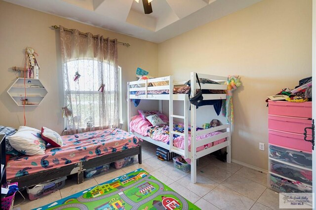 tiled bedroom with ceiling fan