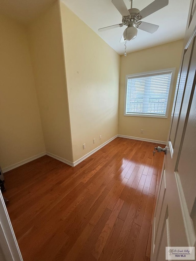 117 Palm Valley Cir, Harlingen, TX 78552 - spare room with wood-type flooring, baseboards, and ceiling fan