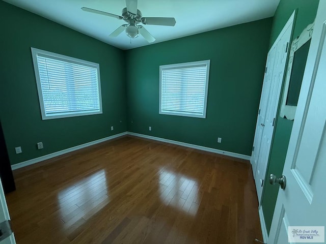 117 Palm Valley Cir, Harlingen, TX 78552 - unfurnished bedroom with wood finished floors, baseboards, and ceiling fan