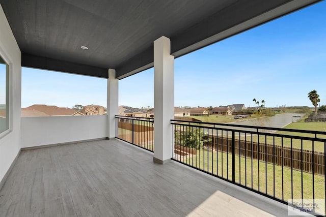 wooden deck with a lawn