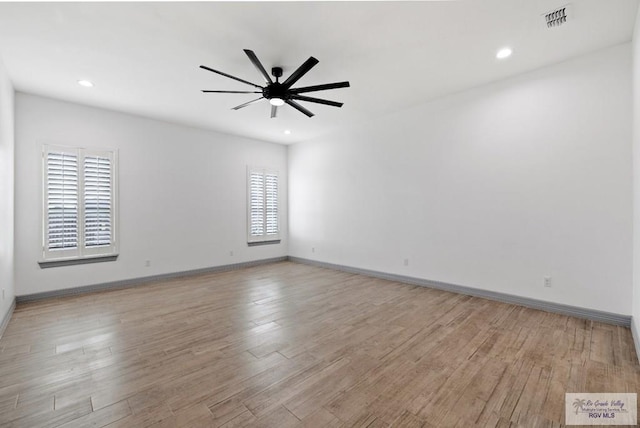 empty room featuring ceiling fan and light wood-type flooring