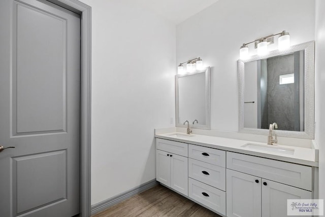 bathroom featuring vanity and hardwood / wood-style floors