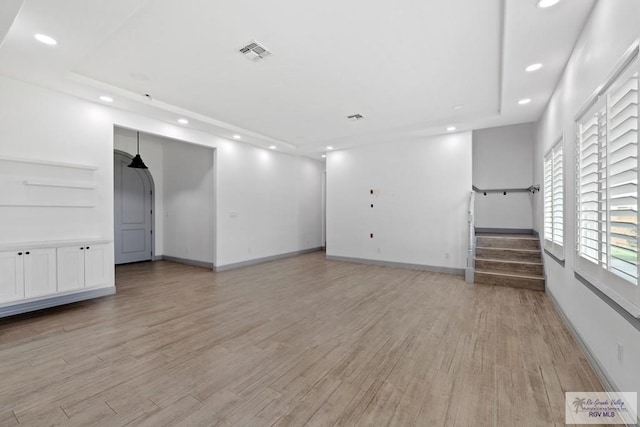 unfurnished living room with light wood-type flooring