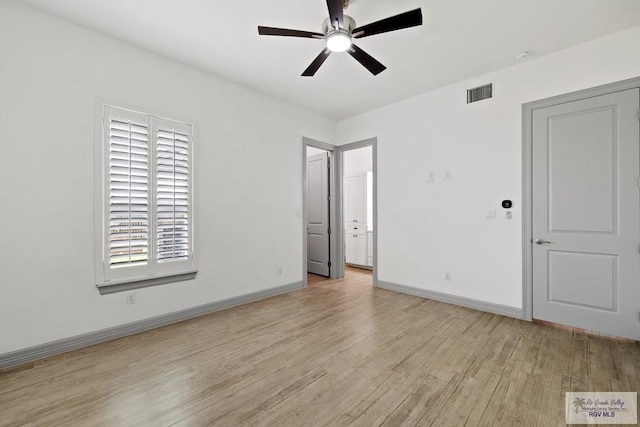 unfurnished room featuring ceiling fan and light wood-type flooring