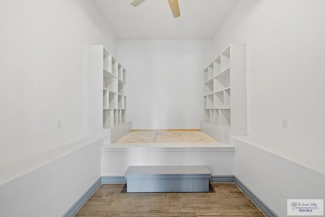 interior space featuring hardwood / wood-style floors and ceiling fan