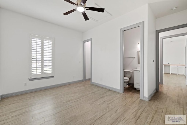 unfurnished bedroom with ensuite bath and light wood-type flooring