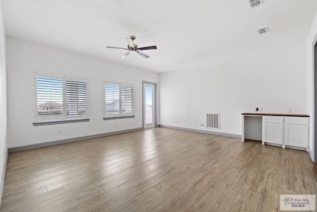 unfurnished room with ceiling fan and light hardwood / wood-style floors