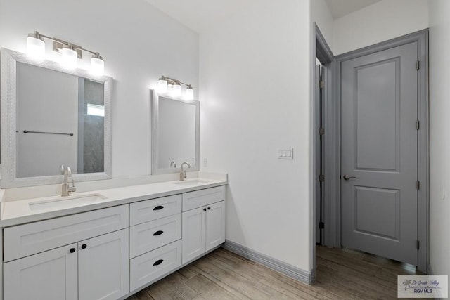 bathroom featuring vanity and hardwood / wood-style floors