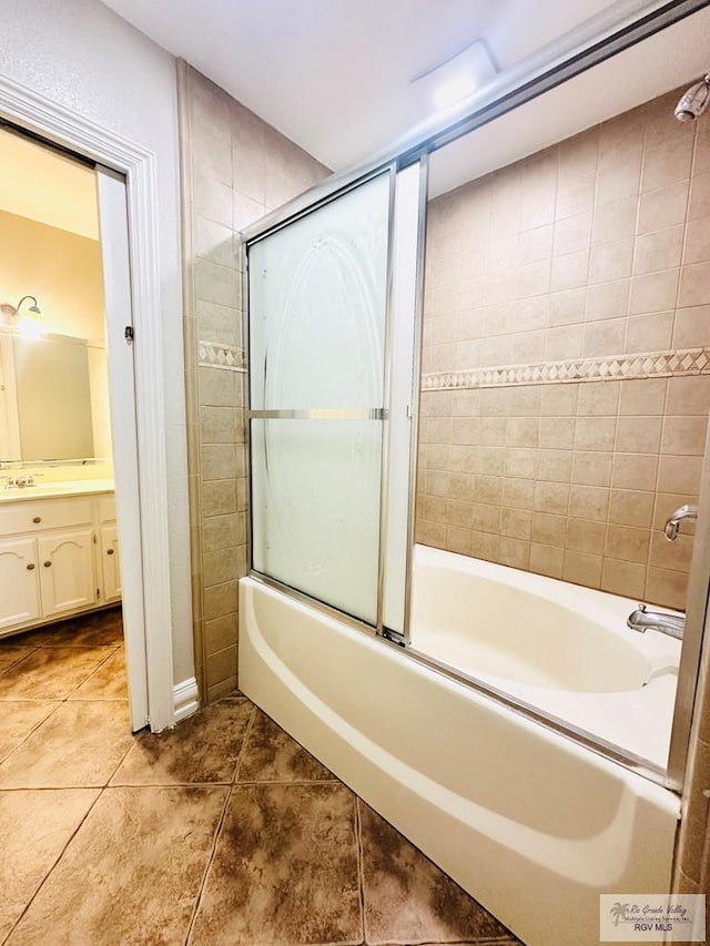 2200 E 19th St, Mission, TX 78572 - bathroom featuring vanity, tile patterned flooring, and bath / shower combo with glass door
