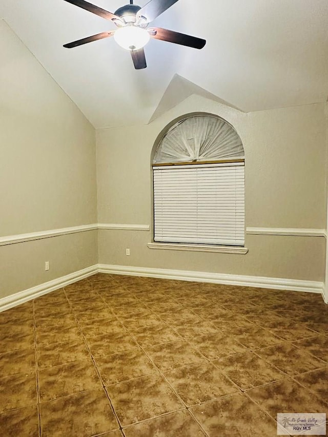 2200 E 19th St, Mission, TX 78572 - tiled spare room with vaulted ceiling, a ceiling fan, and baseboards