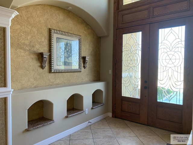 tiled foyer entrance with french doors