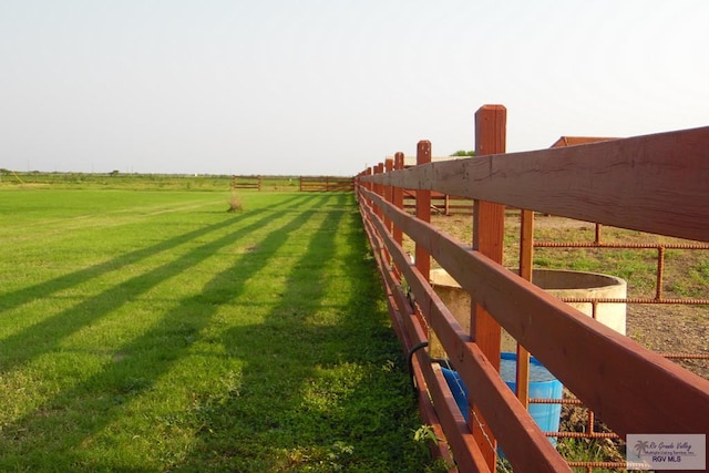 view of yard with a rural view