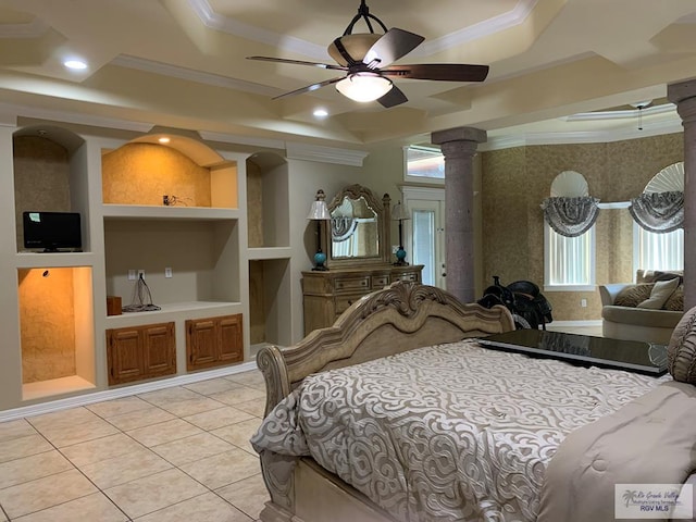 tiled bedroom with decorative columns, ceiling fan, crown molding, and a tray ceiling