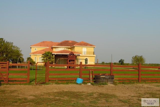 view of jungle gym with a rural view